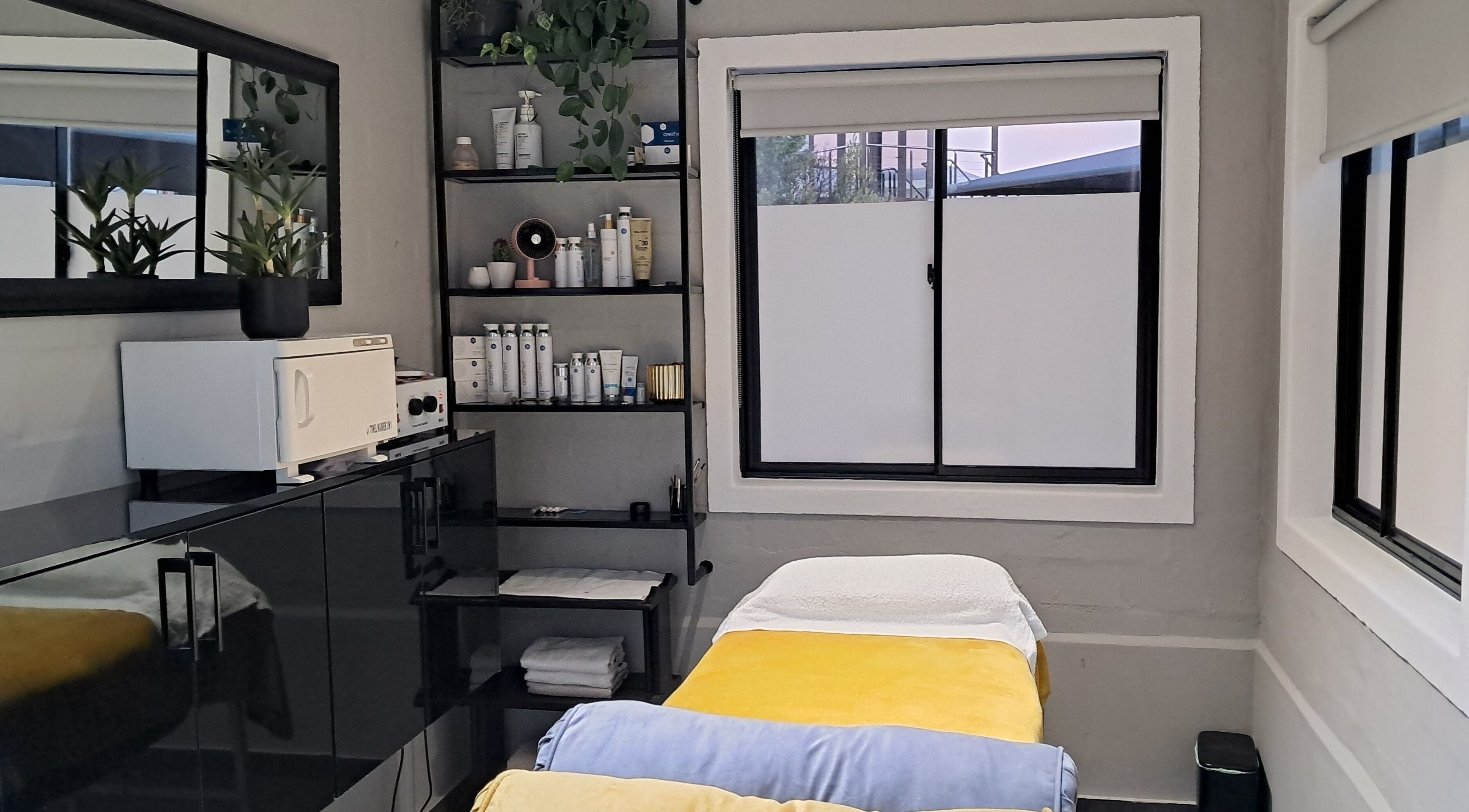 Chontell at Dames en Here spa room with cozy bed in Stellenbosch, Western Cape, ZA.