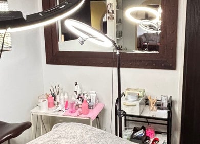 Inside NDI Aesthetics PMU Laser and Lash Beauty Salon, Cape Town. Modern treatment area with lighting.