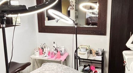Inside NDI Aesthetics PMU Laser and Lash Beauty Salon, Cape Town. Modern treatment area with lighting.