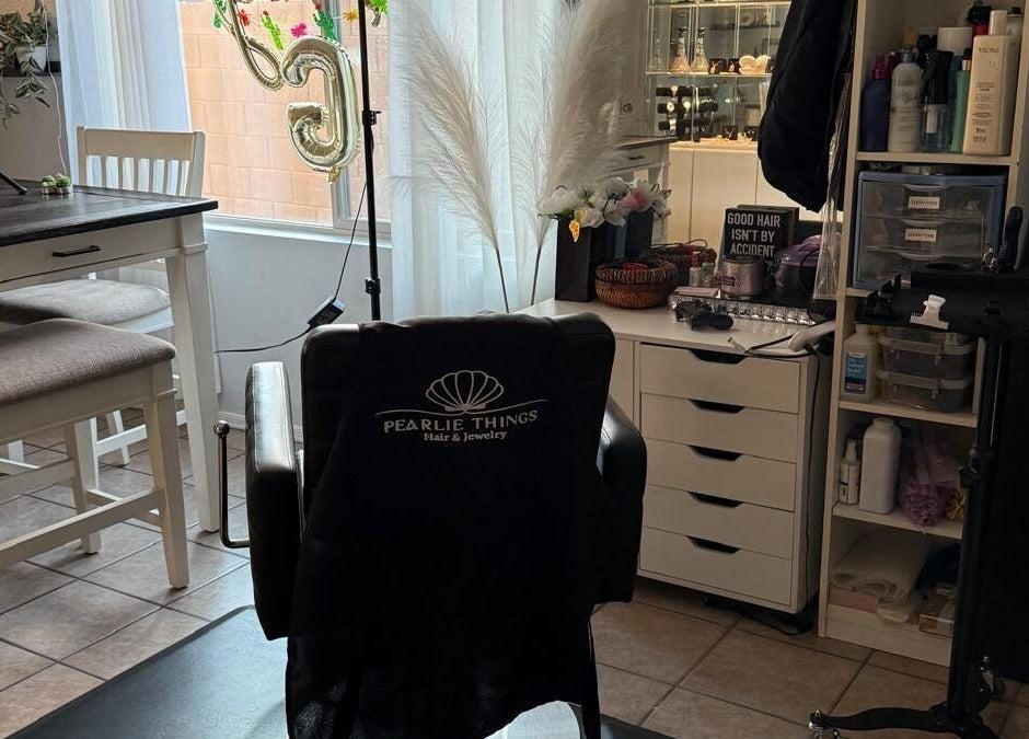 Cozy salon chair at Pearlie Things, Phoenix, Arizona, US, with styling tools and decor.