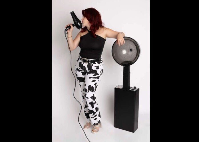 Professional stylist at Pearlie Things with modern hair tools in Phoenix, Arizona, US.