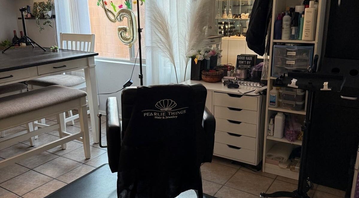 Stylish salon chair in Pearlie Things, Phoenix, Arizona, US, surrounded by beauty products and decor.
