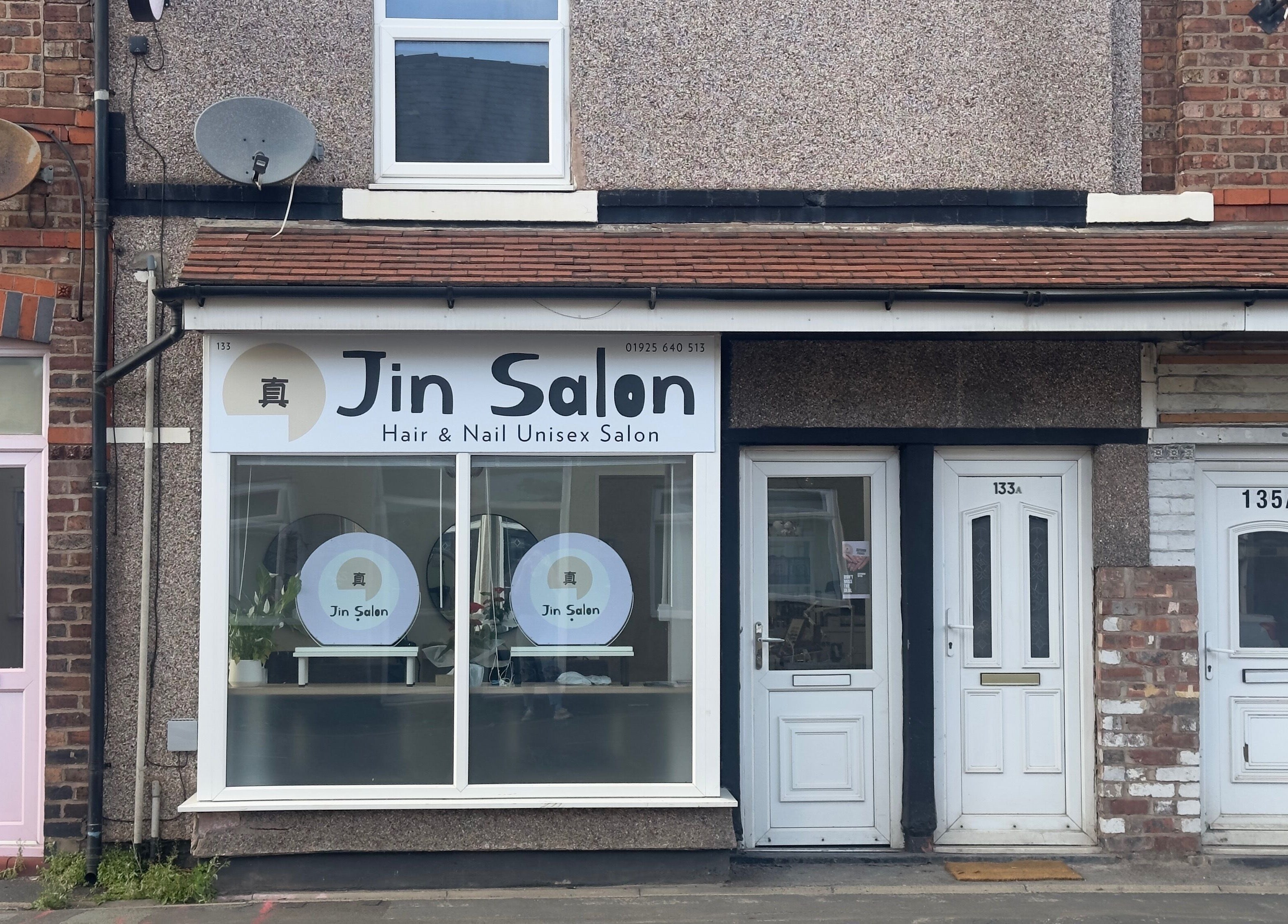 Exterior view of 真Jin Salon in Warrington, England, GB, showcasing the salon's stylish entrance.