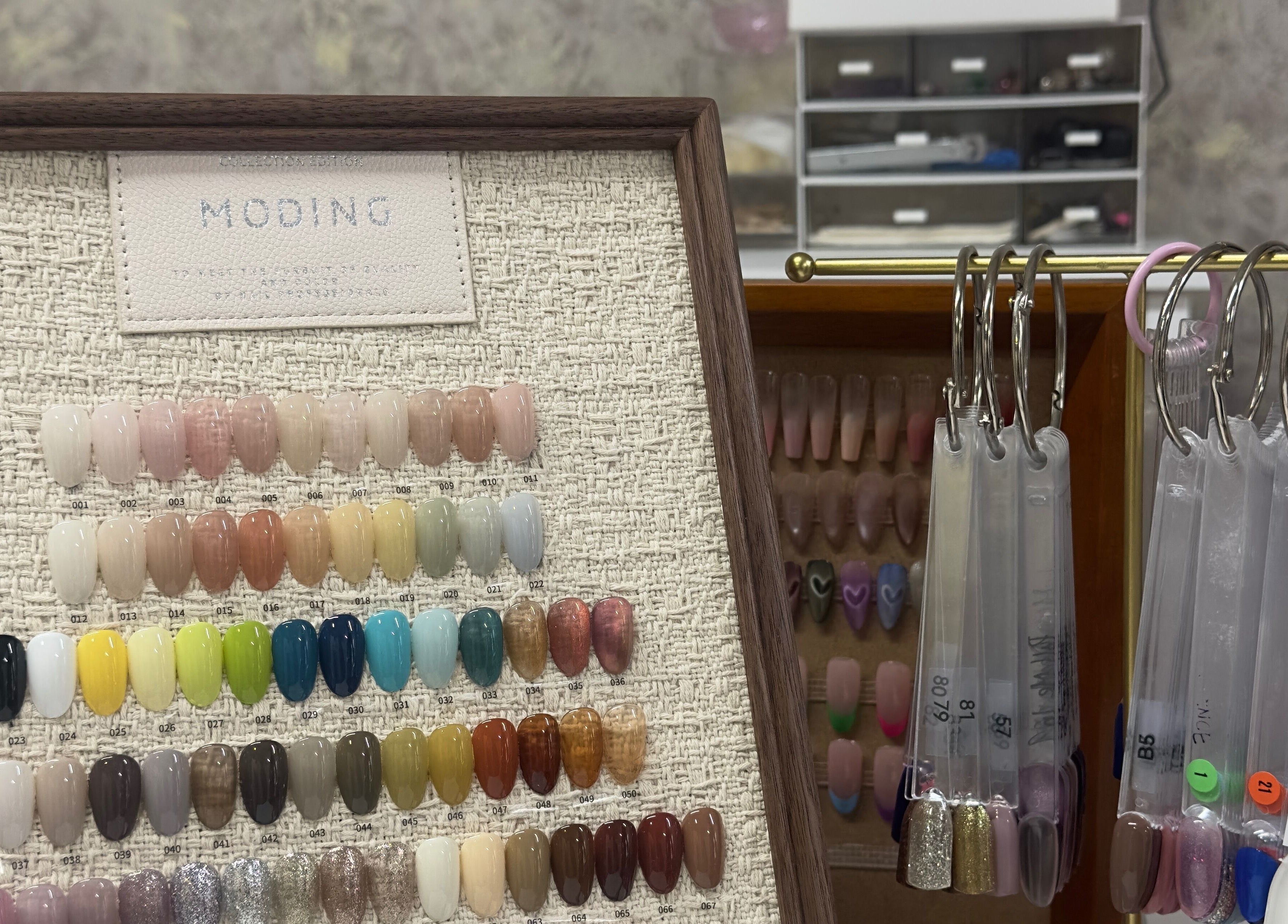 Nail polish color samples on display at 真Jin Salon, Warrington, England, GB, showcasing various shades.