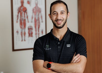 Healion Physiotherapy professional smiling in the clinic office, Nicosia, Nicosia, CY.
