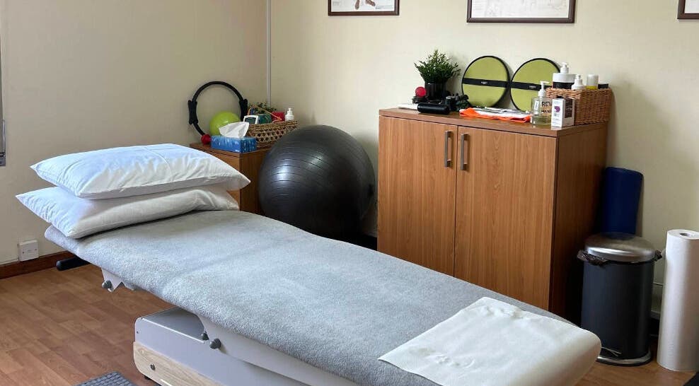 Comfortable therapy room at Healion Physiotherapy in Nicosia, Nicosia, CY featuring a treatment table and equipment.