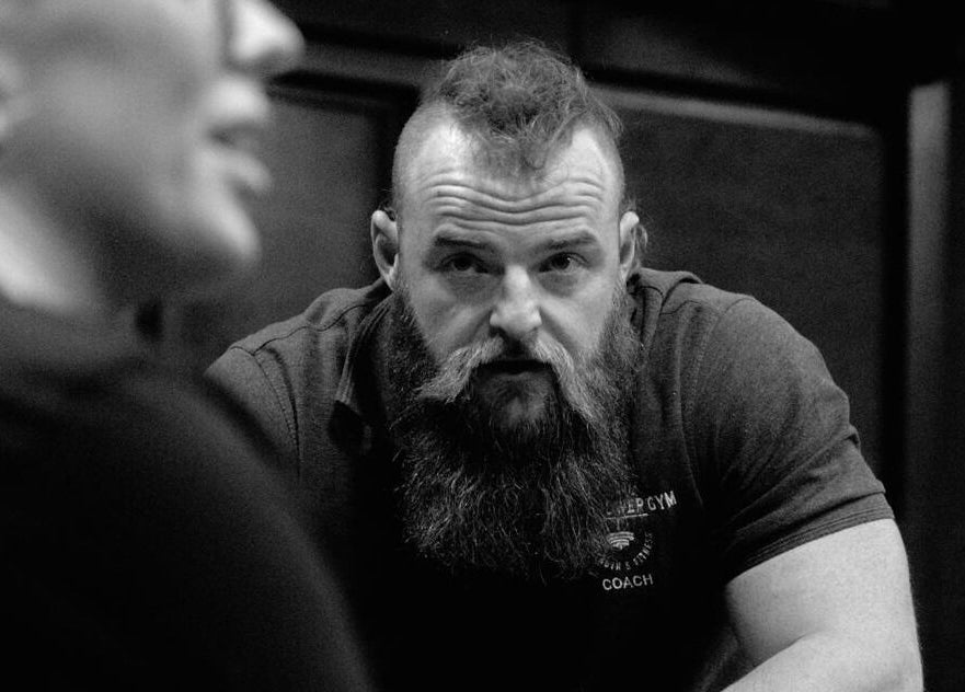 Coach at Aaron Wilman - Mastery of Movement, Whaley Bridge, England, GB, deeply focused during a session.