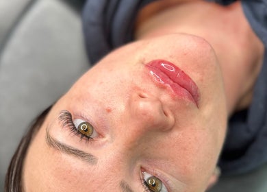 Close-up of a woman's glossy lips at Leanne Jordan Beaute, Kingsteignton, England, GB.