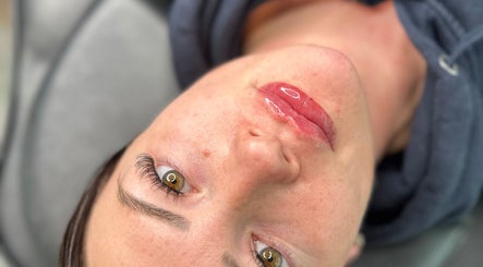 Close-up of a woman's glossy lips at Leanne Jordan Beaute, Kingsteignton, England, GB.