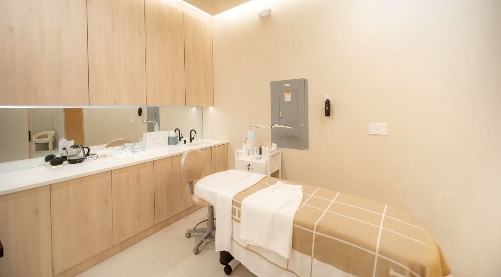 Peaceful treatment room at Brows and Brows in Hallandale Beach, Florida, US, featuring a massage table.