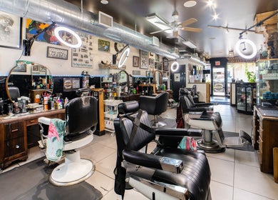 Interior of Cut N Run Barbershop in Toronto, Ontario, CA featuring sleek barber chairs and stylish decor.