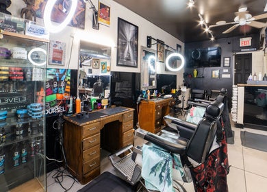 Modern interior of Cut N Run Barbershop in Toronto, Ontario, CA with stylish chairs and hair products.