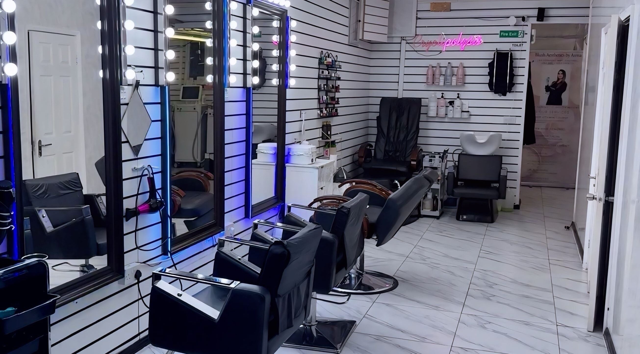 Interior of Blush Hair and Beauty Salon in Hounslow, England, GB showcasing elegant chairs and mirrors.