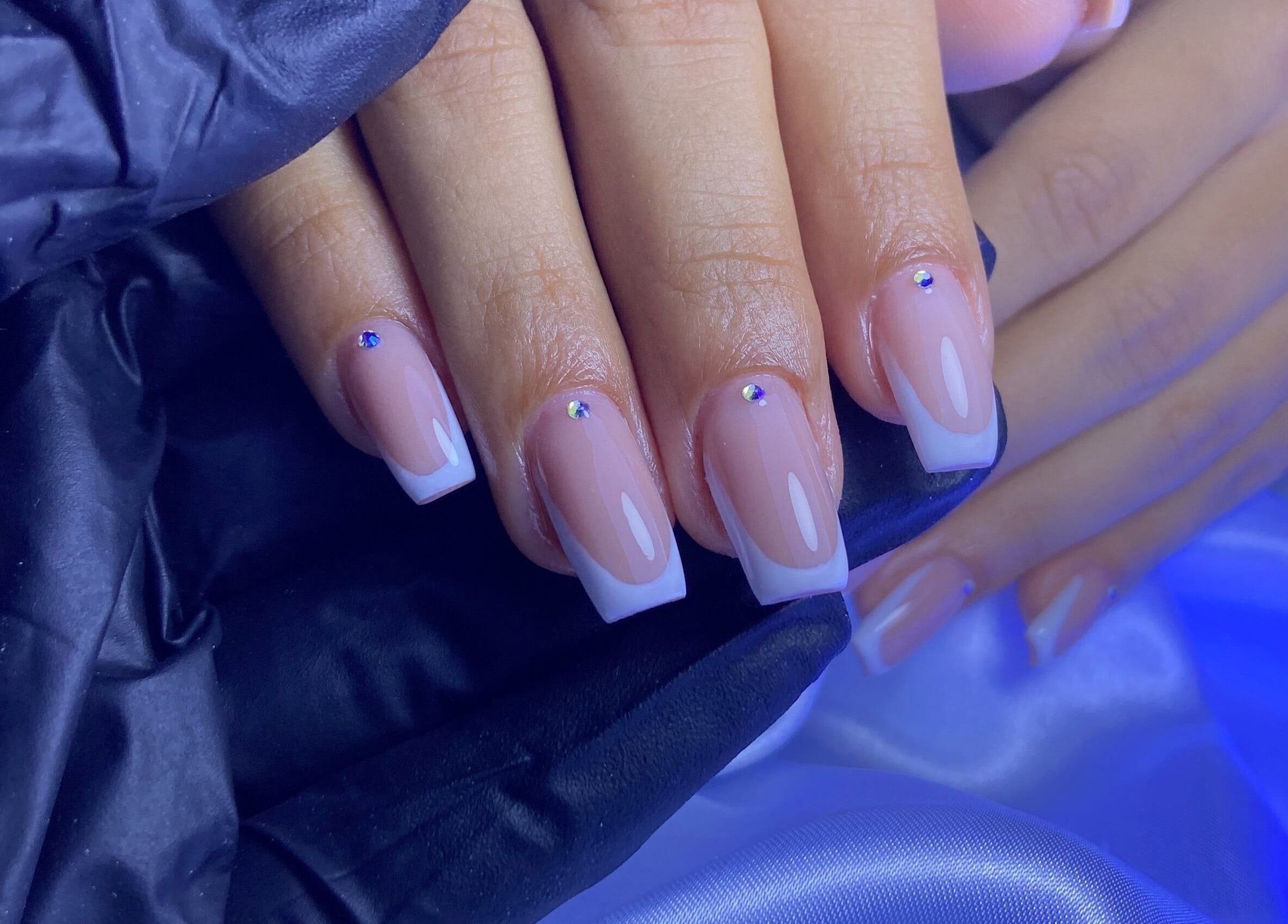 Elegant French manicure with rhinestones at Kshine Aesthetics, Brievengat, Curaçao, CW.