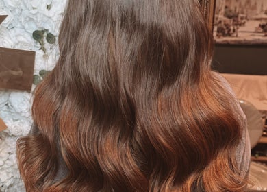 Lustrous wavy hair styled at Hair Extensions by Kinga Liu in Leeds, England, GB.