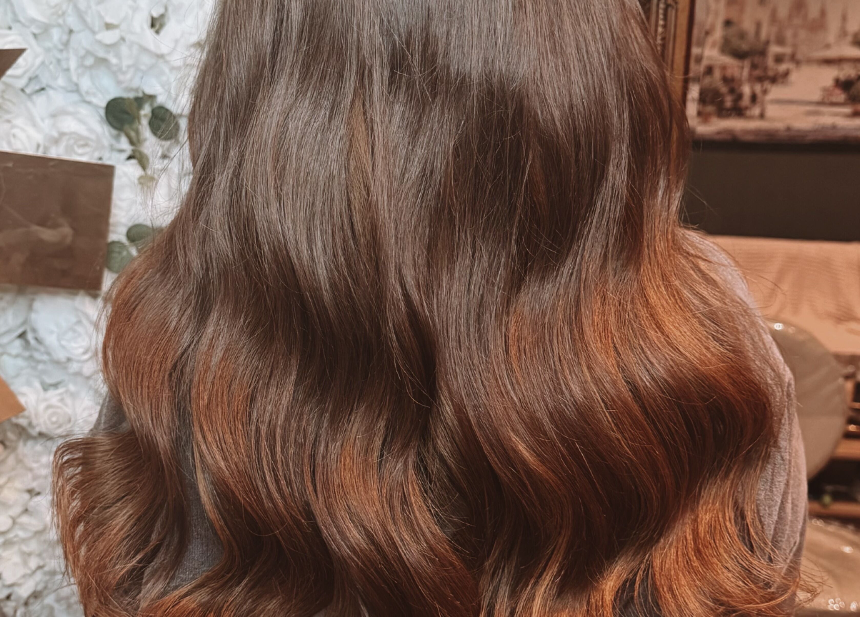 Lustrous wavy hair styled at Hair Extensions by Kinga Liu in Leeds, England, GB.