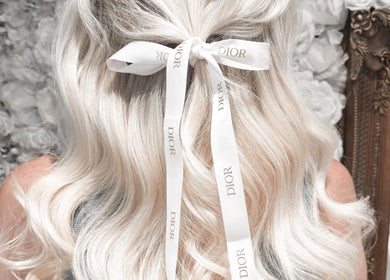 Blonde hair styled with a ribbon at Hair Extensions by Kinga Liu, Leeds, England, GB.