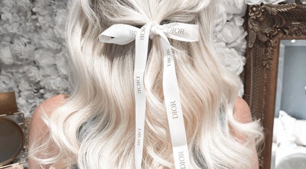 Blonde hair styled with a ribbon at Hair Extensions by Kinga Liu, Leeds, England, GB.