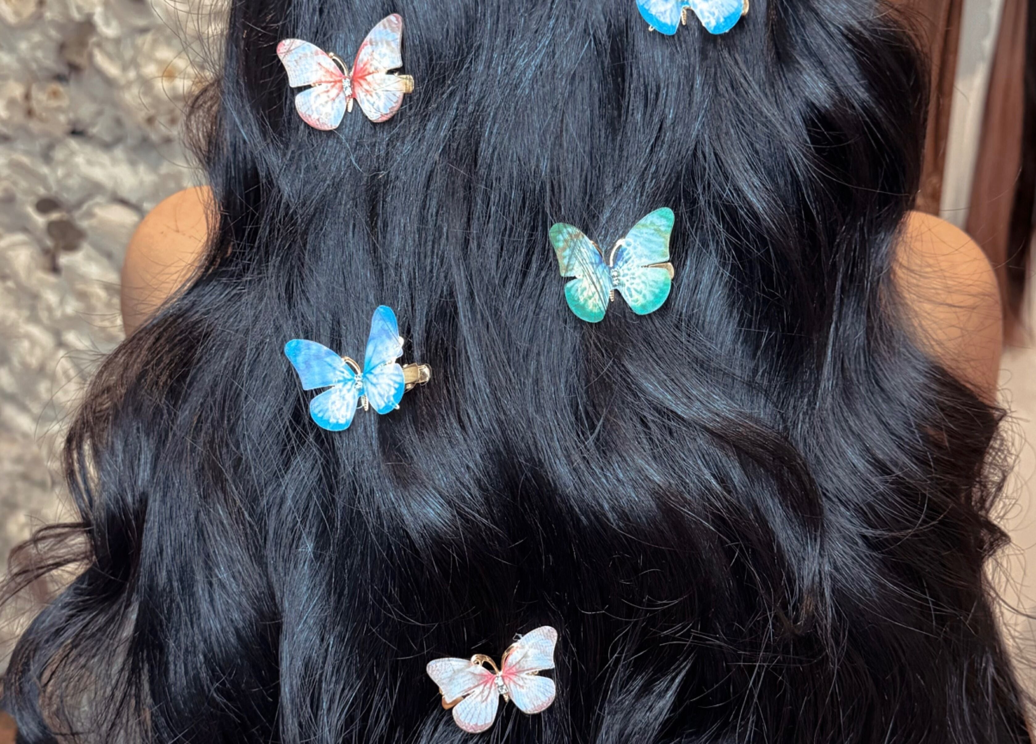 Black hair with butterfly clips at Hair Extensions by Kinga Liu, Leeds, England, GB.