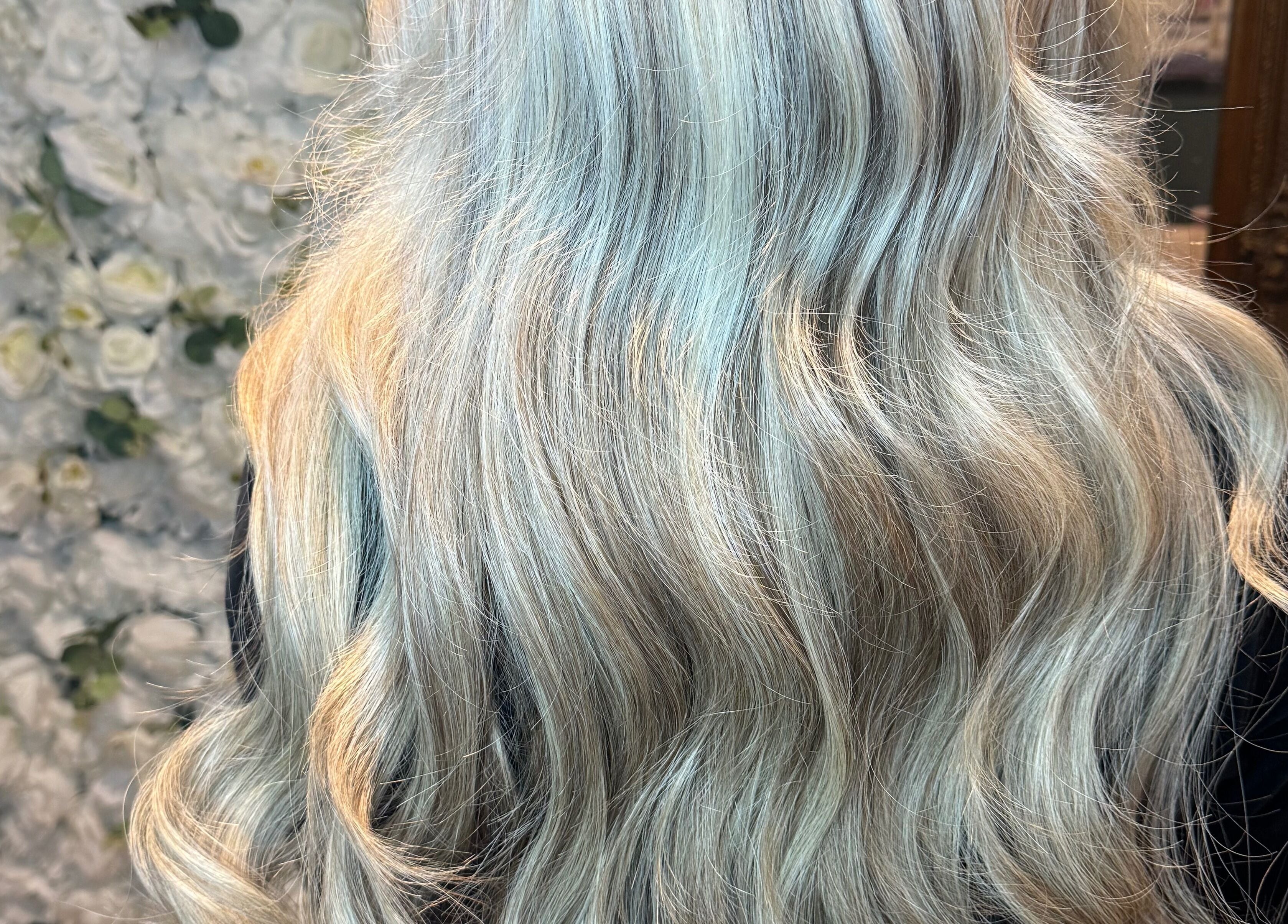 Long, wavy silver hair extensions at Hair Extensions by Kinga Liu in Leeds, England, GB.