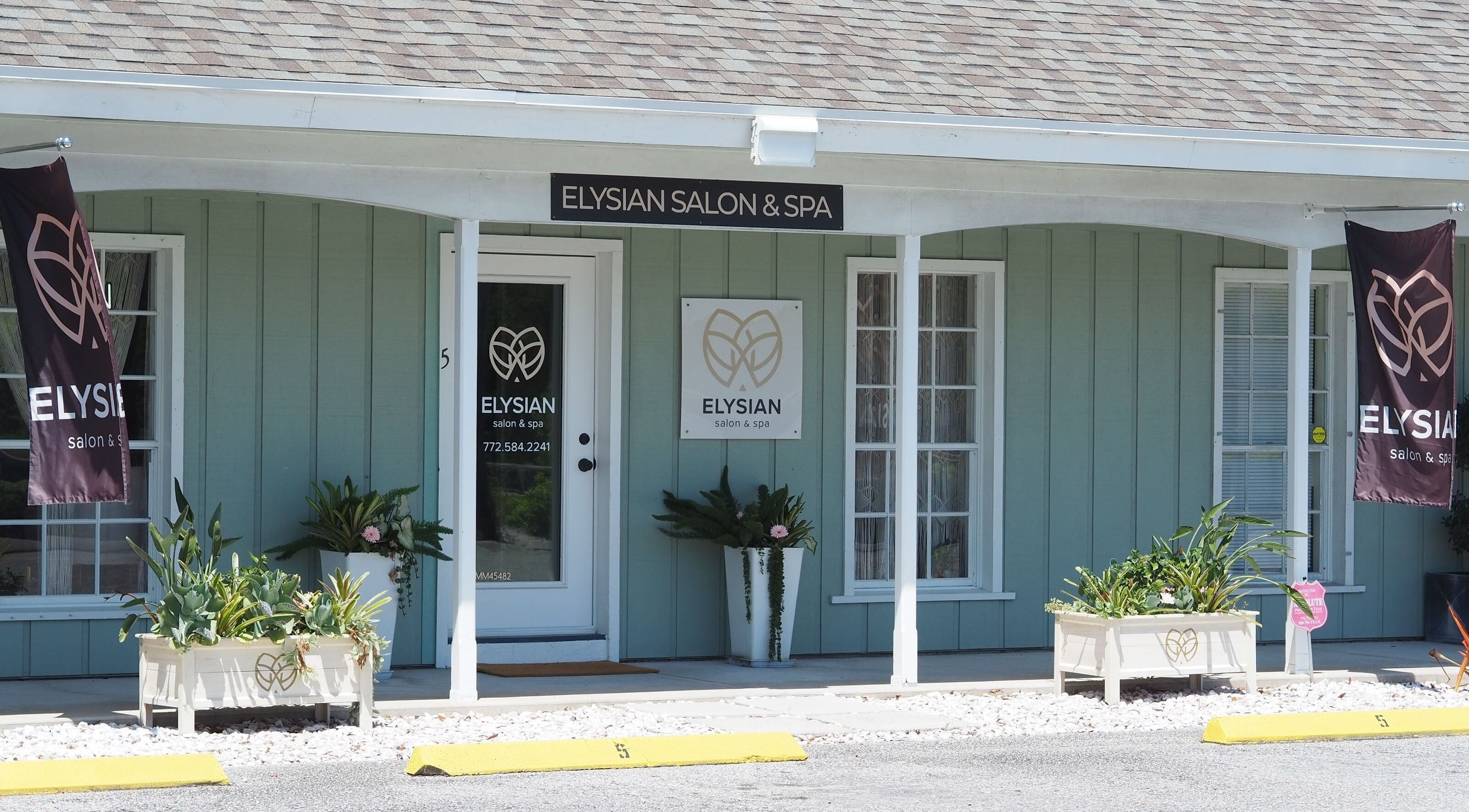 Front view of Elysian Salon and Spa, Vero Beach, Florida, showcasing elegant entrance and signage.