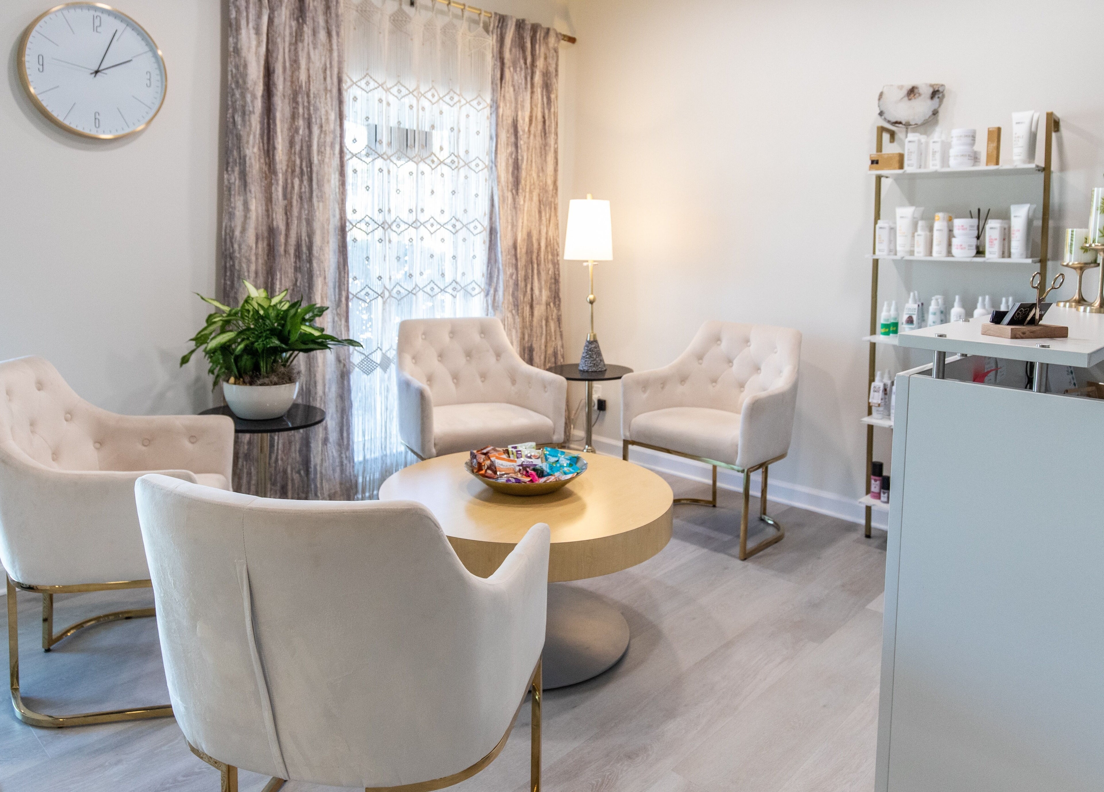 Chic waiting area at Elysian Salon and Spa, Vero Beach, Florida, US, featuring elegant seating and decor.