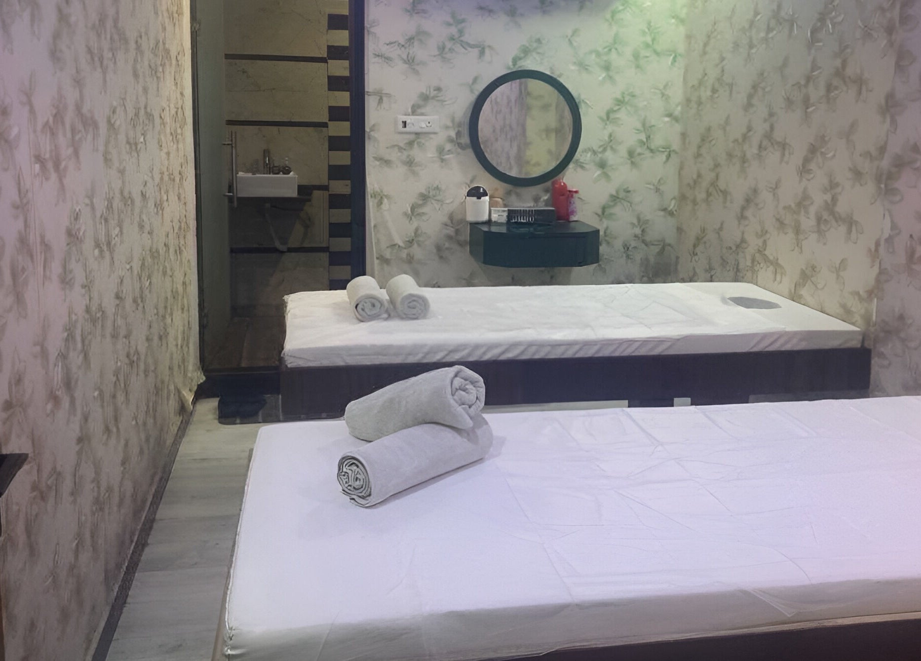 Tranquil treatment room at Medusa Luxury Spa, Raipur, Chhattisgarh, IN, featuring soothing decor and massage tables.