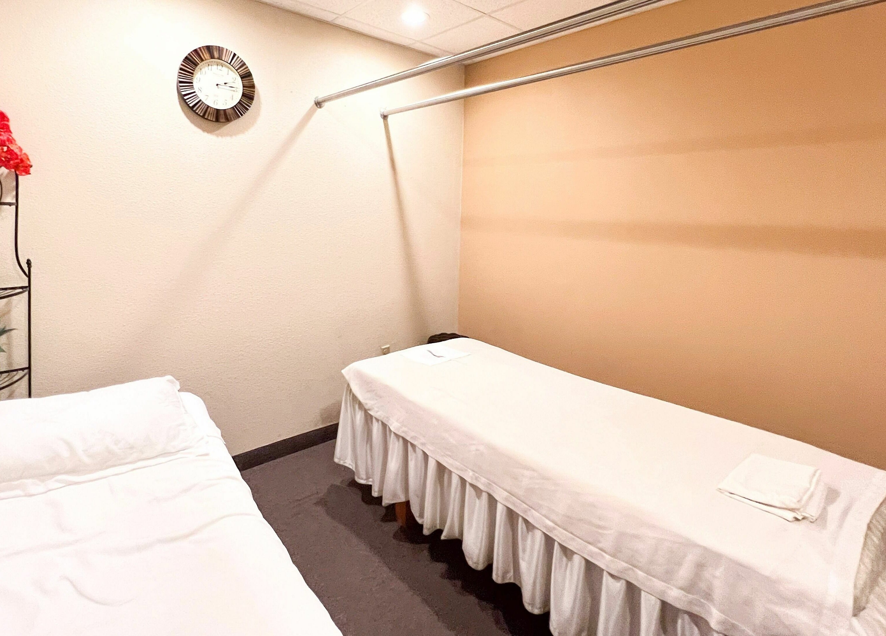 Peaceful massage room at Bluebonnet Massage in Irving, Texas, US, featuring two inviting massage tables.