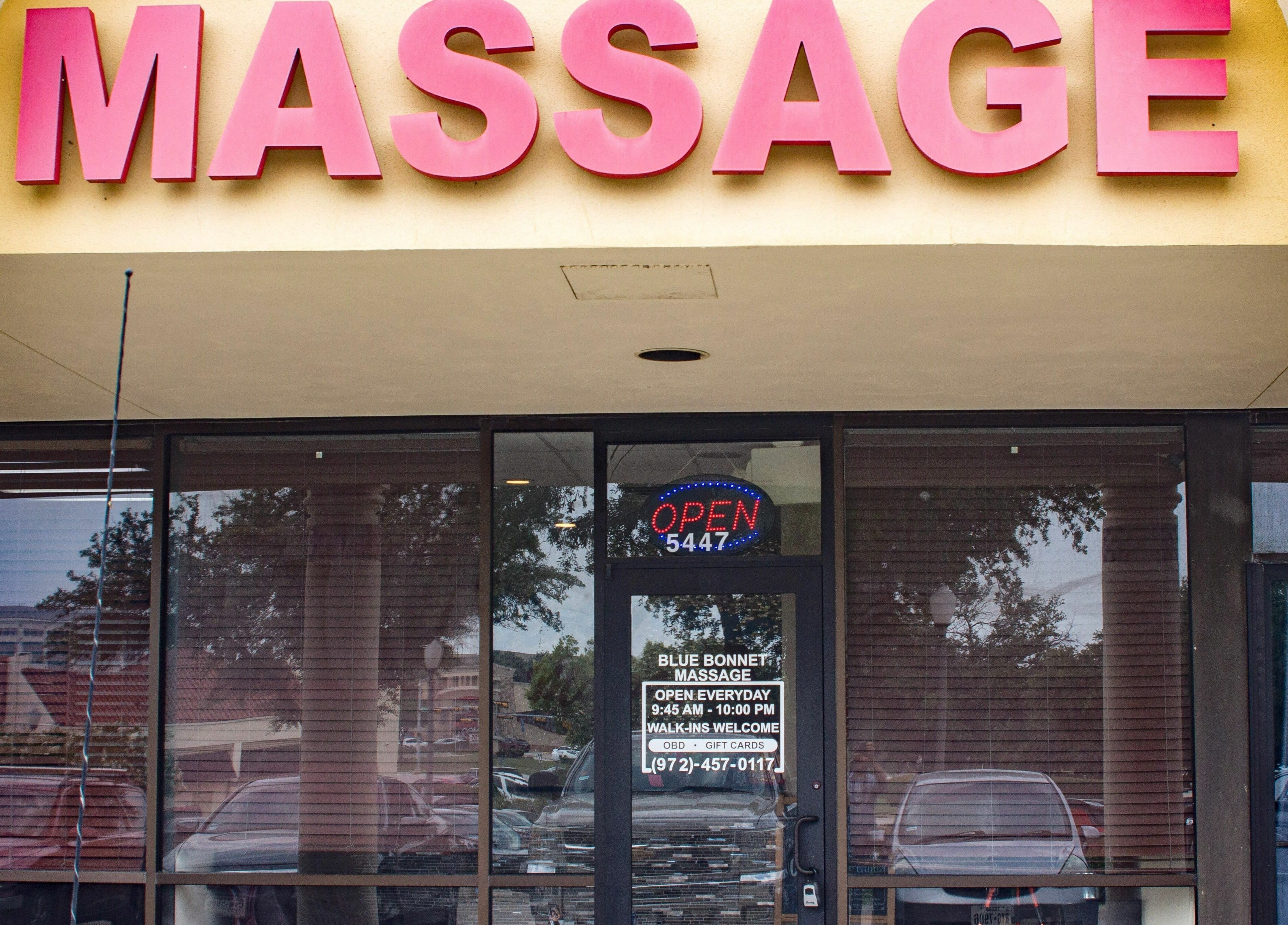 Bluebonnet Massage entrance under bright signage, located in Irving, Texas, US. Inviting and welcoming atmosphere.