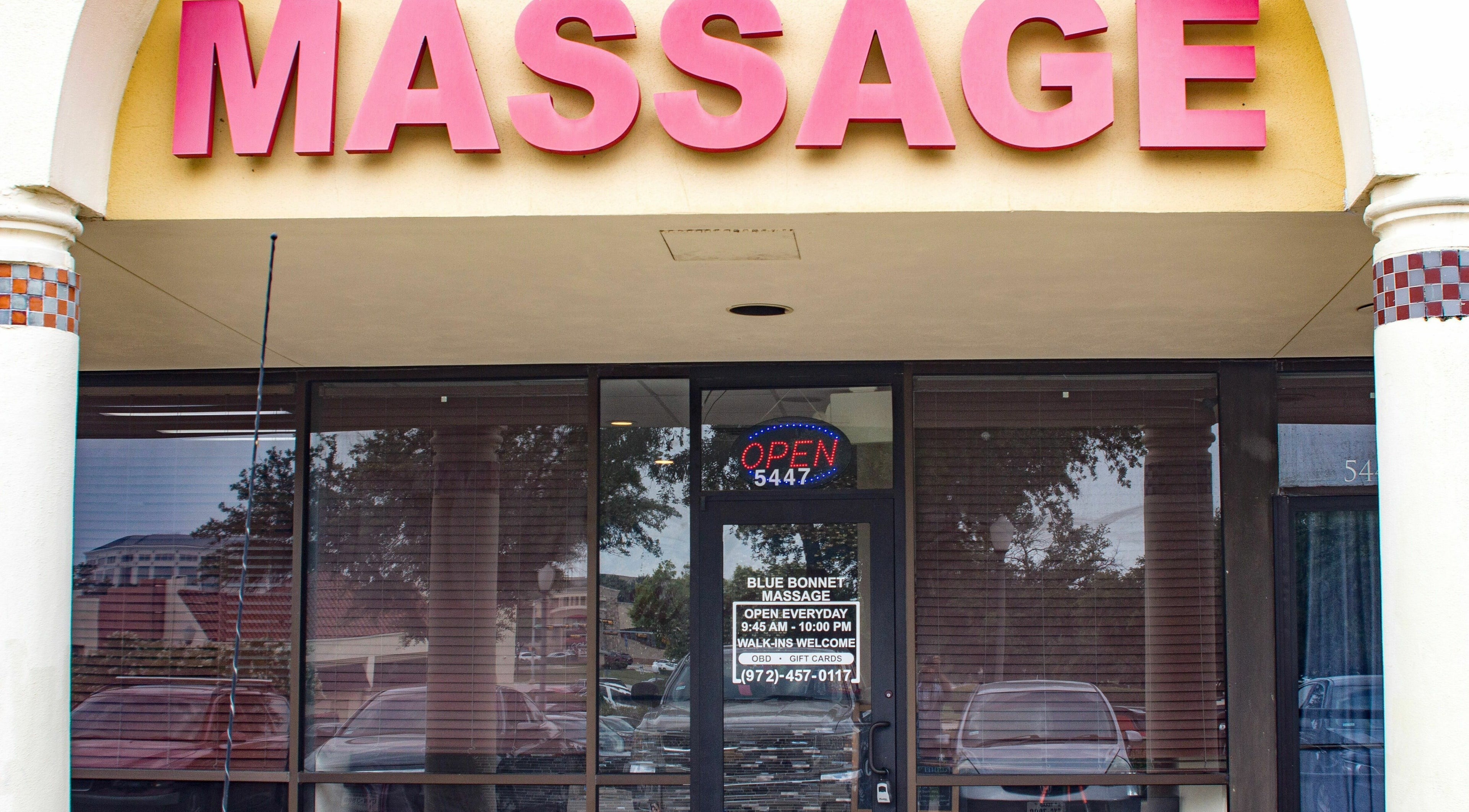 Bluebonnet Massage entrance under bright signage, located in Irving, Texas, US. Inviting and welcoming atmosphere.