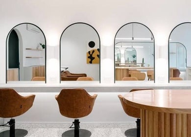 Modern salon interior at Emily Ferguson at Salon ES, Collaroy Plateau, New South Wales, AU with stylish mirrors.