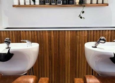 Modern wash basins at Emily Ferguson at Salon ES, Collaroy Plateau, New South Wales, AU, offering luxury haircare.