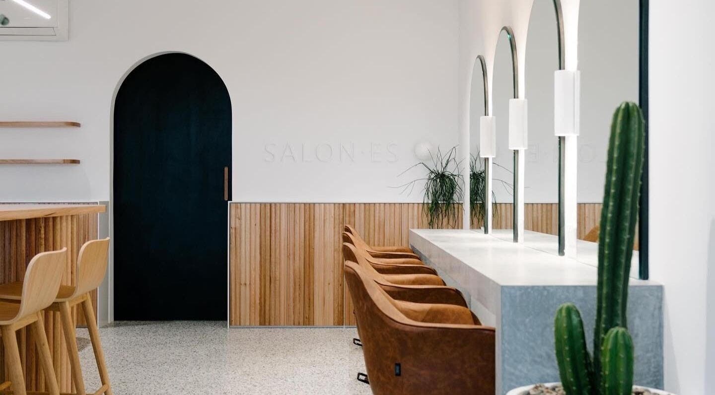 Modern interior of Emily Ferguson at Salon ES, Collaroy Plateau, NSW, highlighting sleek design and seating.