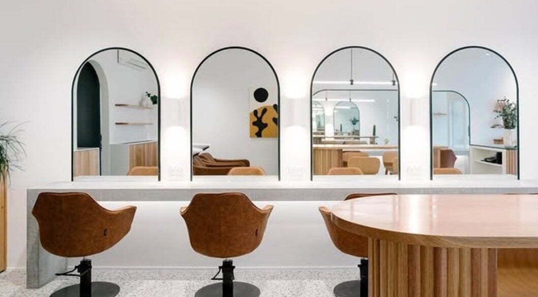 Modern salon interior at Emily Ferguson at Salon ES, Collaroy Plateau, New South Wales, AU featuring elegant mirrors and chairs.