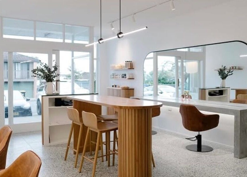 Modern salon interior at Emily Ferguson at Salon ES, Collaroy Plateau, New South Wales, AU, with elegant seating.