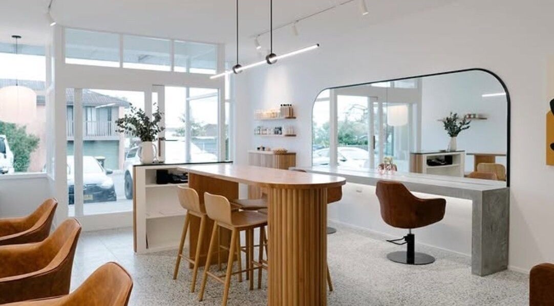 Modern salon interior at Emily Ferguson at Salon ES, Collaroy Plateau, New South Wales, AU, with elegant seating.