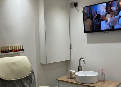 Cozy nail station at BN STUDIO, Coventry, England, GB with colorful polish and a relaxing setup.