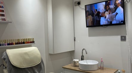 Cozy nail station at BN STUDIO, Coventry, England, GB with colorful polish and a relaxing setup.