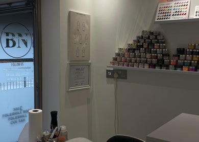 A display of colorful nail polish jars at BN STUDIO, Coventry, England, GB, showcasing product variety.