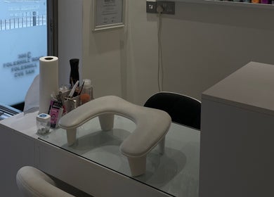 Chic manicure station at BN STUDIO in Coventry, England, GB with tools and padded armrest.