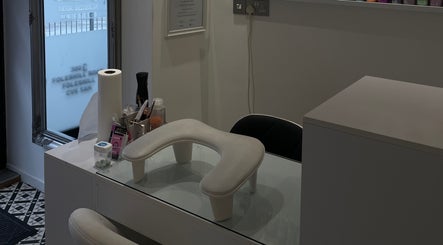 Chic manicure station at BN STUDIO in Coventry, England, GB with tools and padded armrest.