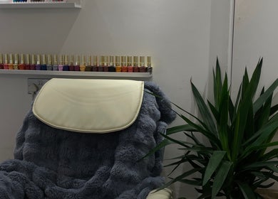 Luxurious nail lounge at BN STUDIO, Coventry, England, GB with plush seating and vibrant polish display.