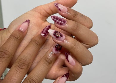 Intricate nail art design at BN STUDIO, Coventry, England, GB featuring pink and purple patterns.