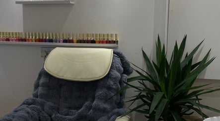 Luxurious nail salon chair with nail polish display at BN STUDIO, Coventry, England, GB.