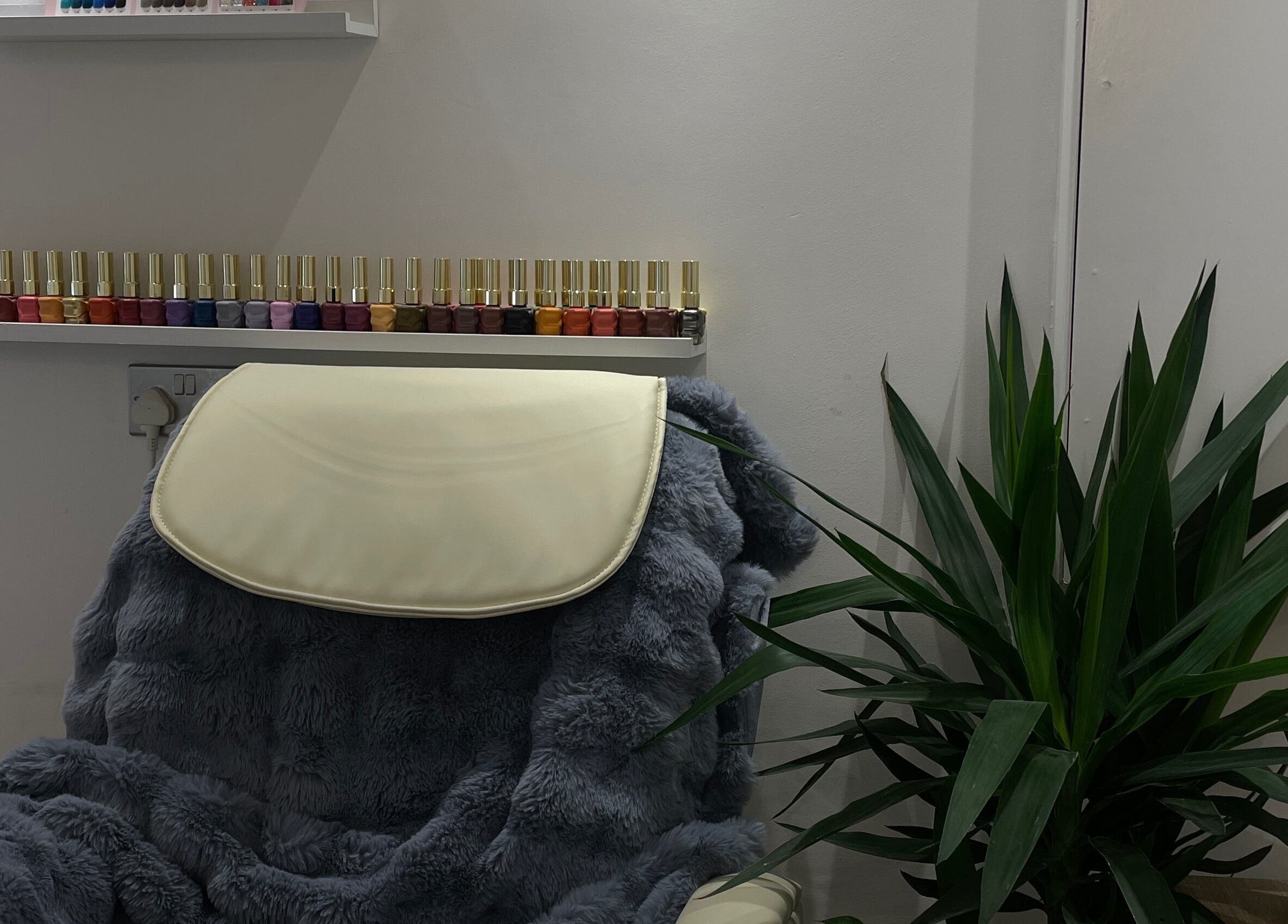 Cozy seating area with nail polish display at BN STUDIO, Coventry, England, GB.