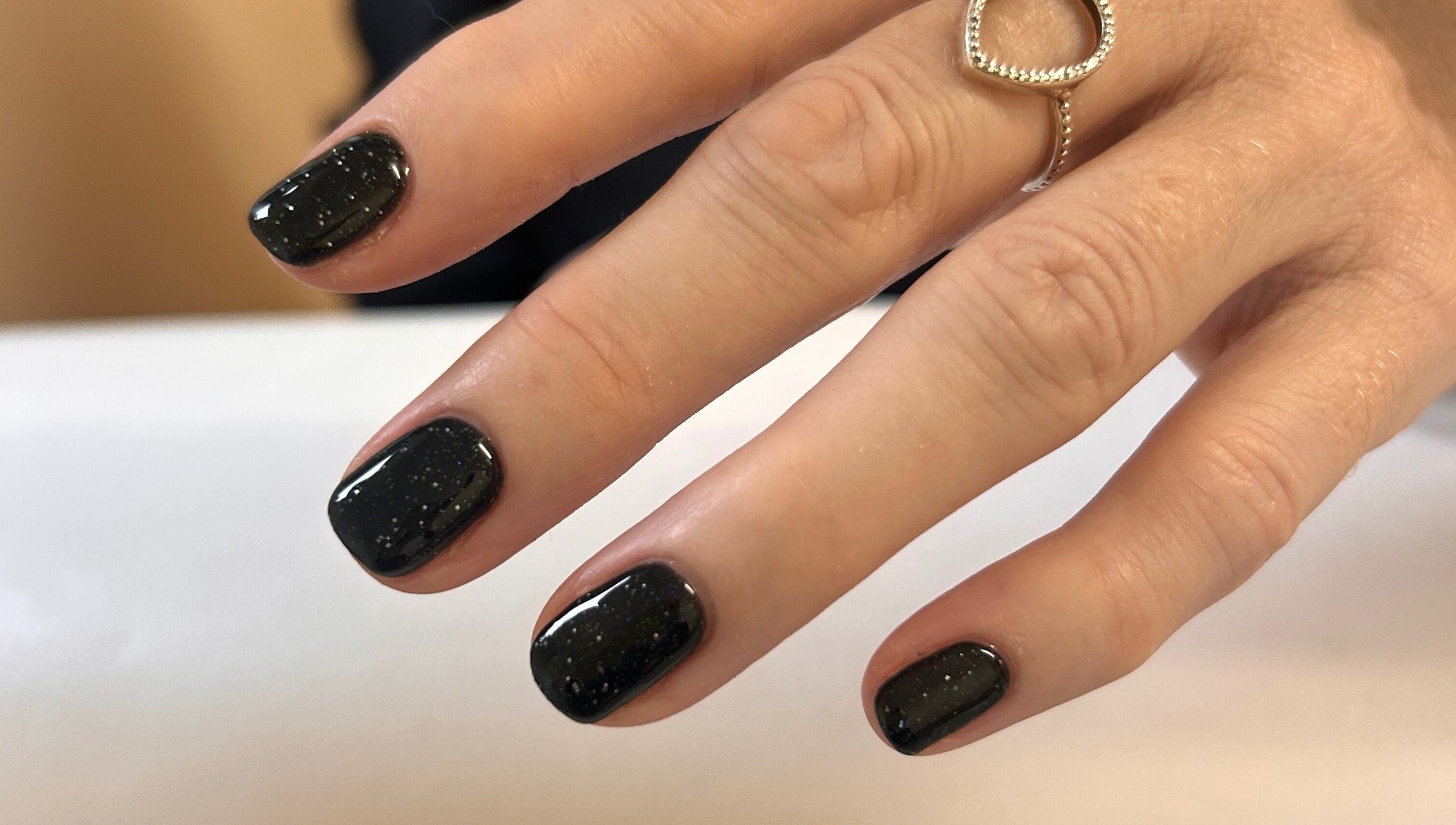 Black polished nails at Shefford Manicurist in Shefford, England, GB showcasing elegant nail art.