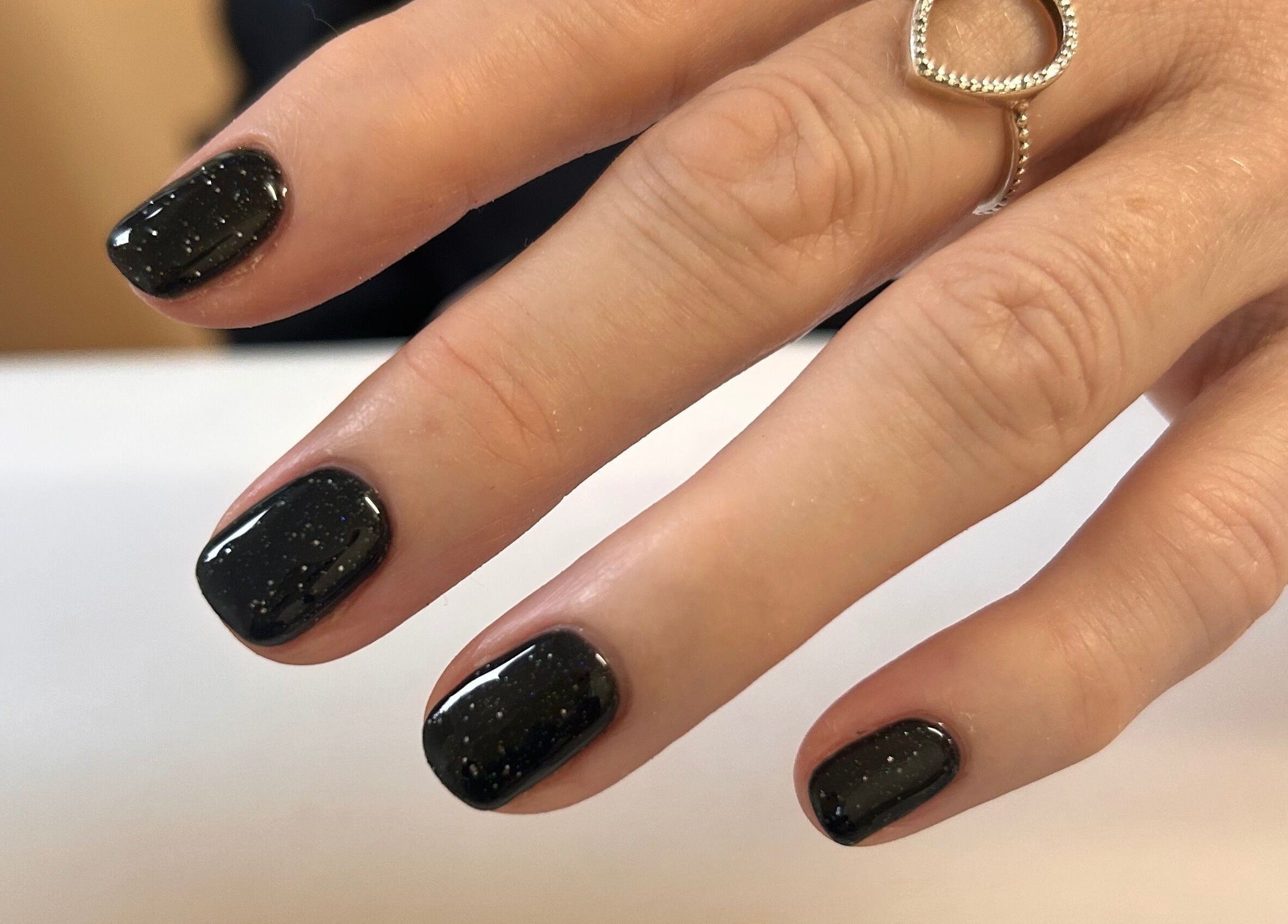 Black polished nails at Shefford Manicurist in Shefford, England, GB showcasing elegant nail art.