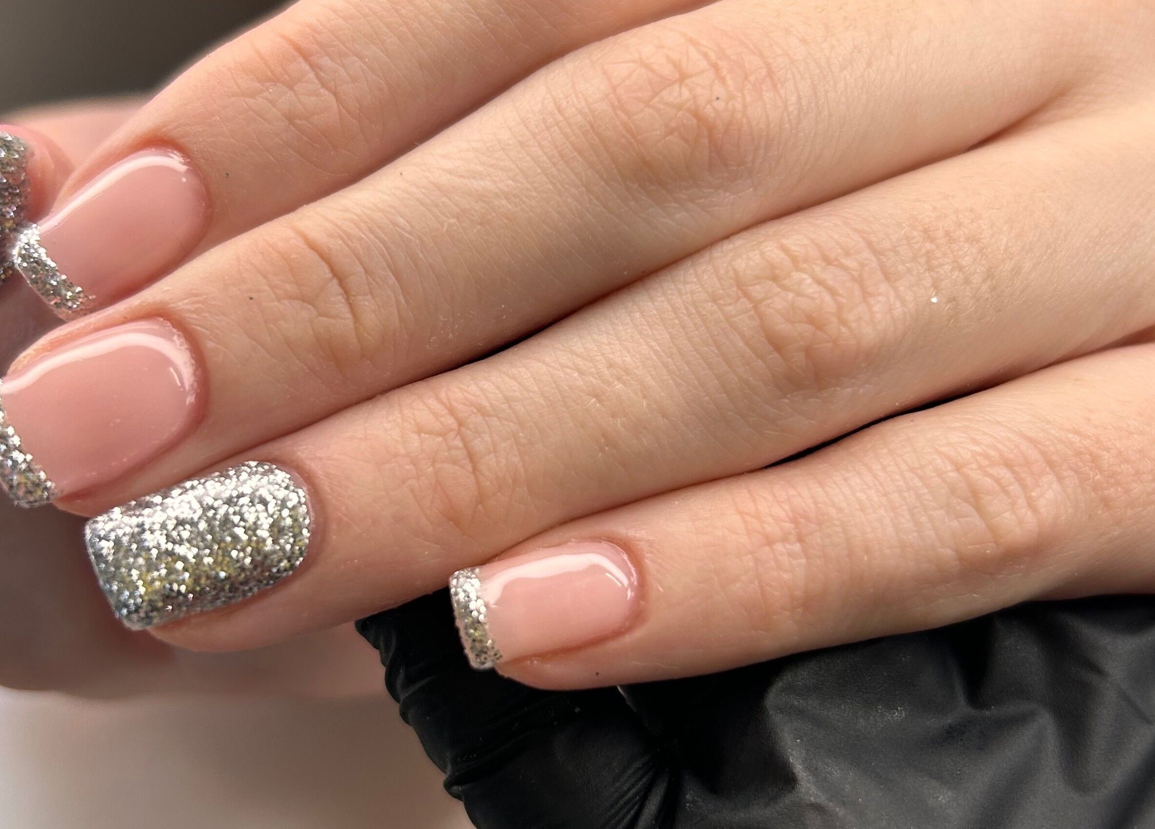 Elegant silver-glitter French manicure at Shefford Manicurist, Shefford, England, GB.
