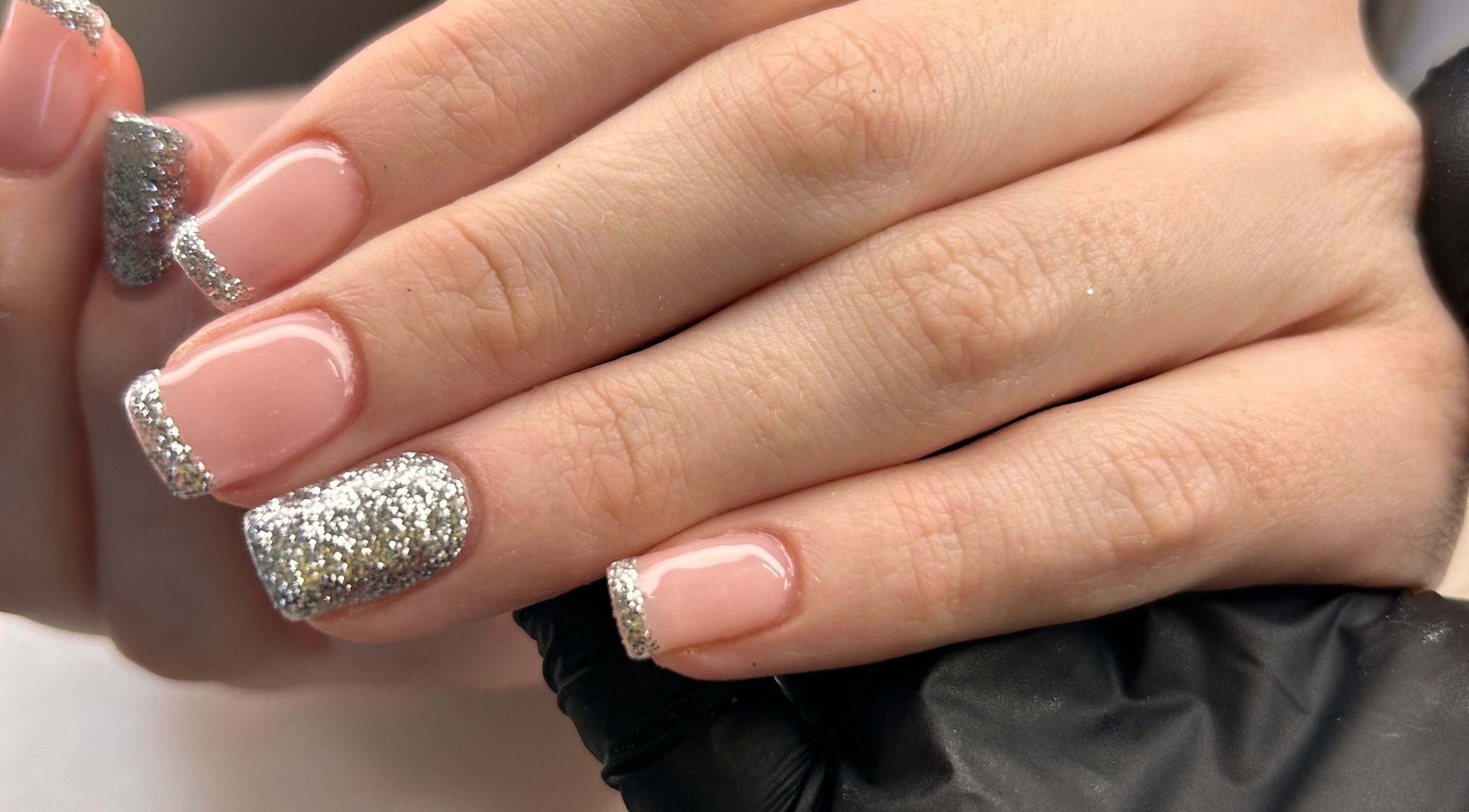 Elegant silver-glitter French manicure at Shefford Manicurist, Shefford, England, GB.