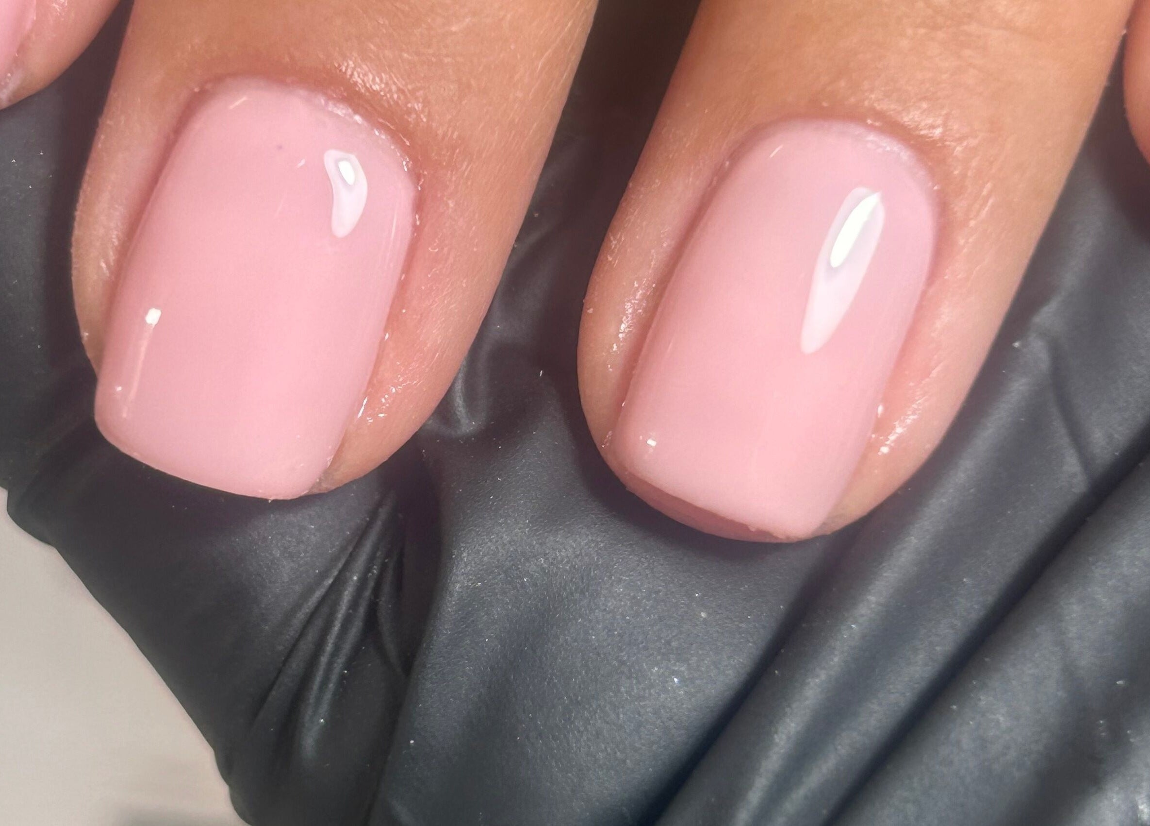 Close-up of glossy pink nails by Shefford Manicurist at Shefford, England, GB.